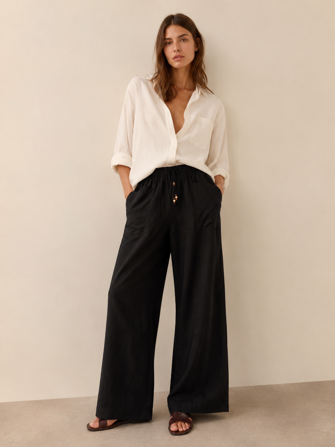 Wide-Leg Linen Blend Trousers
Effortlessly refined with a relaxed silhouette,
